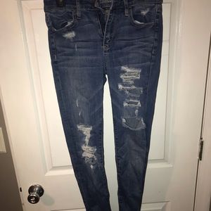 High waisted distressed jeans. Stretchy and 4 Long